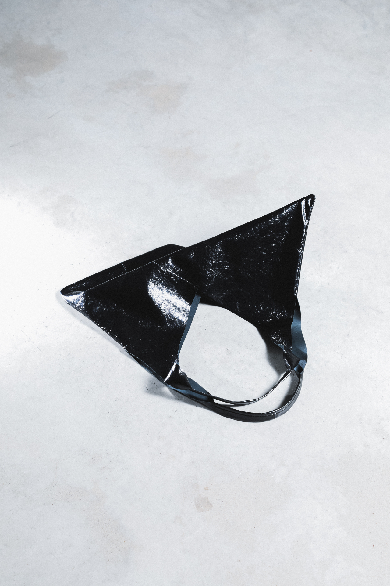 Black folded leather bag from above